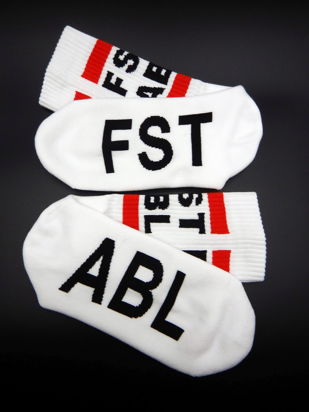 close-up of our sk8erboy fst abl socks for all guys who are into fisting and love these fluffy socks with a large red stripe and logo lettering