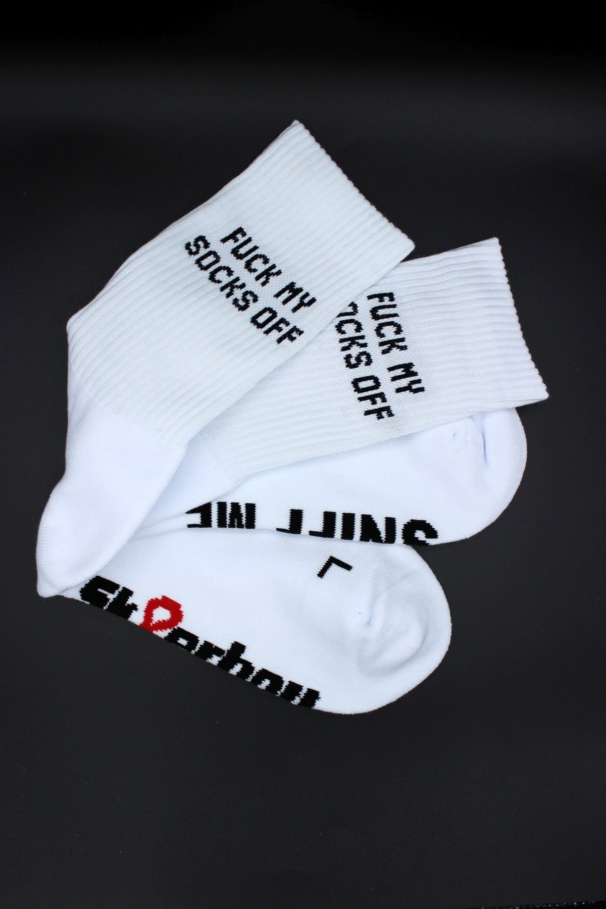 white Sk8erboy socks with "sniff me" on the underside and large logo in detail view